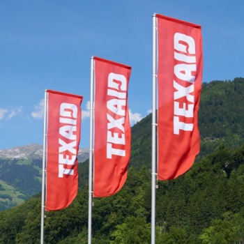 TEXAID logo with flags